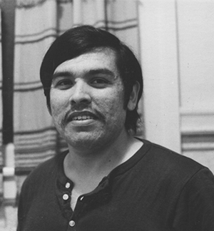 Black and white headshot of younger Juan Gonzales 