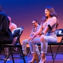 Actresses sit on chairs on a stage
