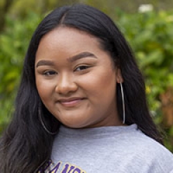 Headshot of woman wearing an SF State sweatshirt